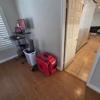 HEPA air scrubber set up in a Lake Elsinore bedroom during water damage drying