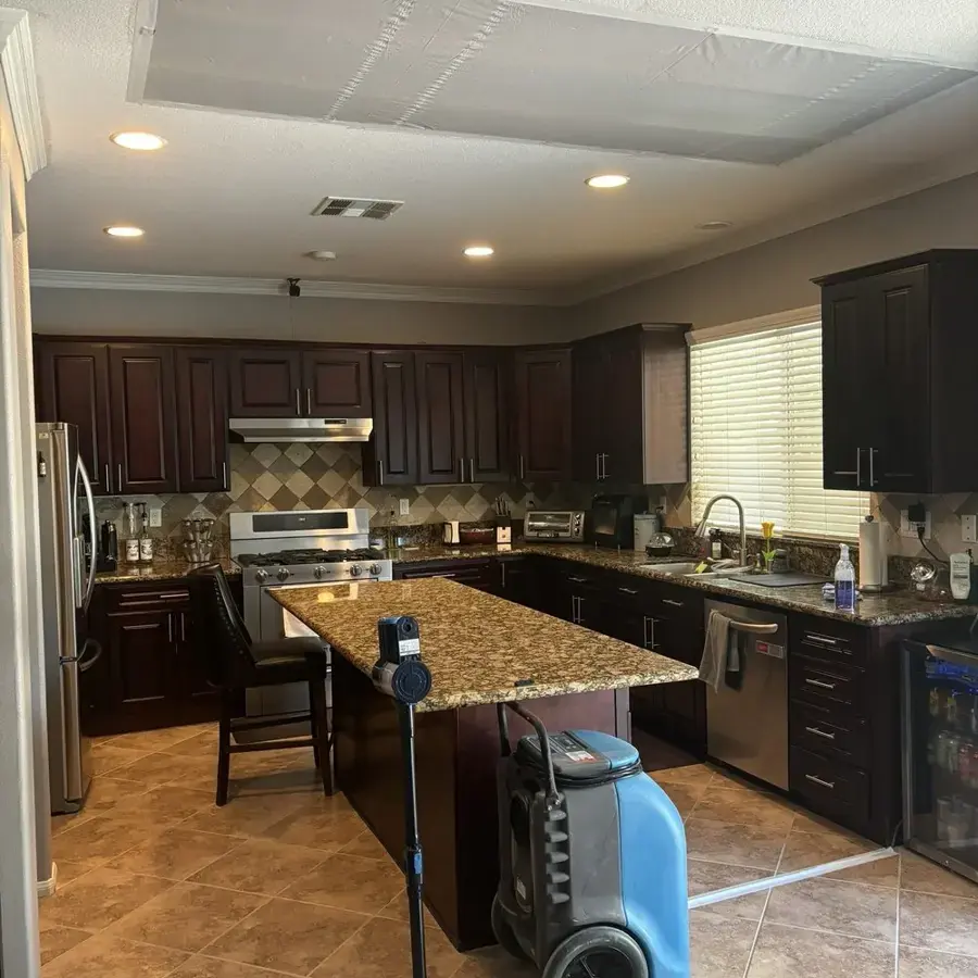 Dehumidifier drying a Lake Elsinore kitchen after an appliance supply line leak