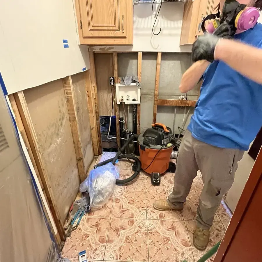 Wet drywall and cabinets removed from a Lake Elsinore utility room during cleanup